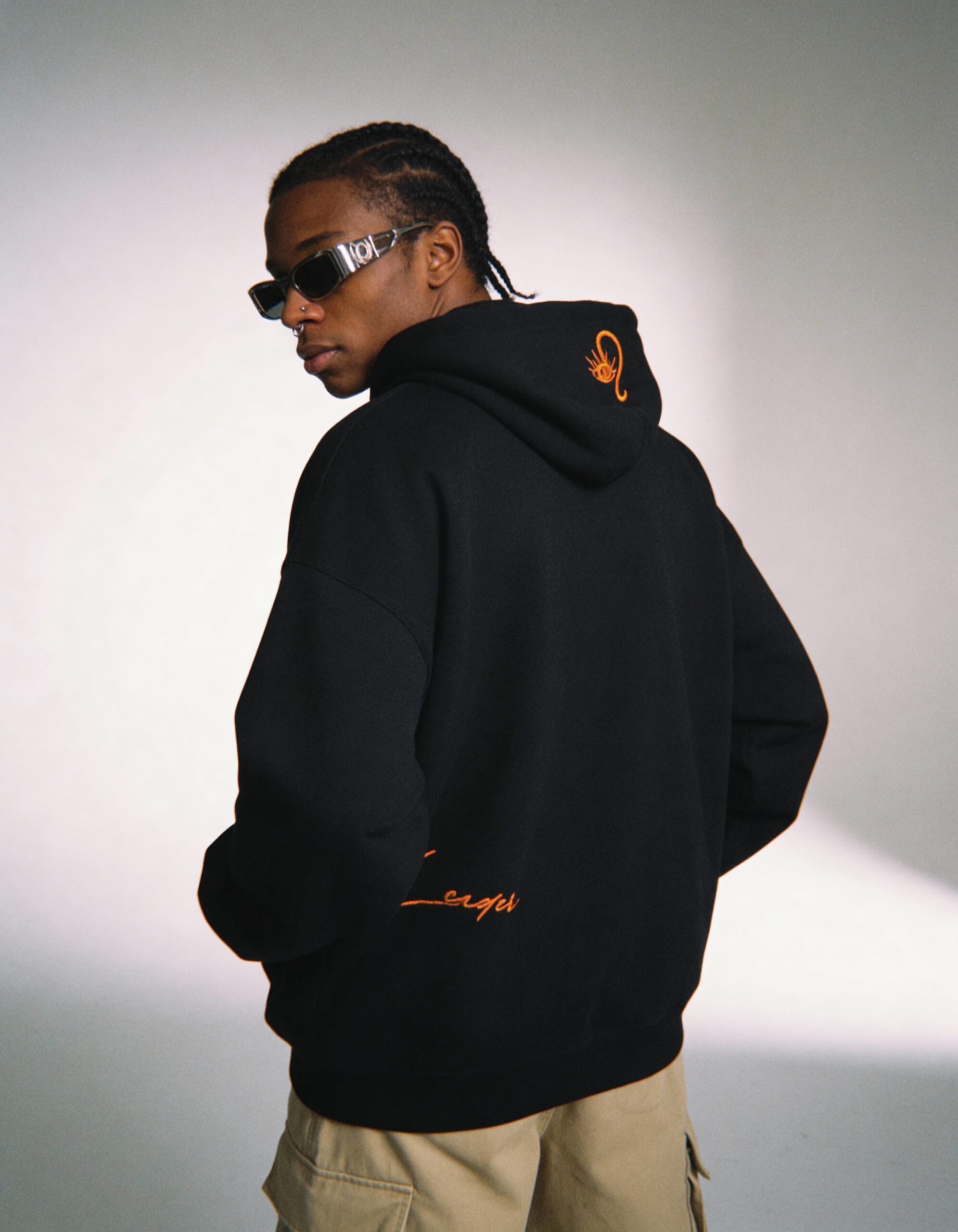 freepik__darkskinned-man-with-braided-hair-and-wearing-a-no__71305 Leo Embroidery Hoodie For Men - Image 2